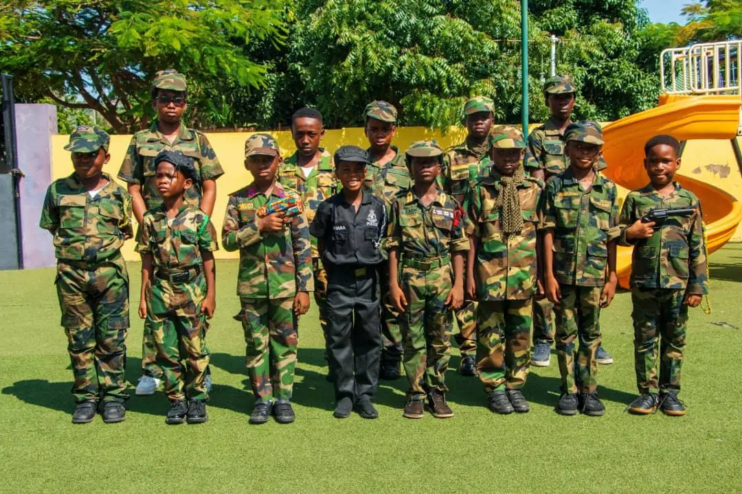 A group of HABIS pupils posing outdoors in camouflage costumes