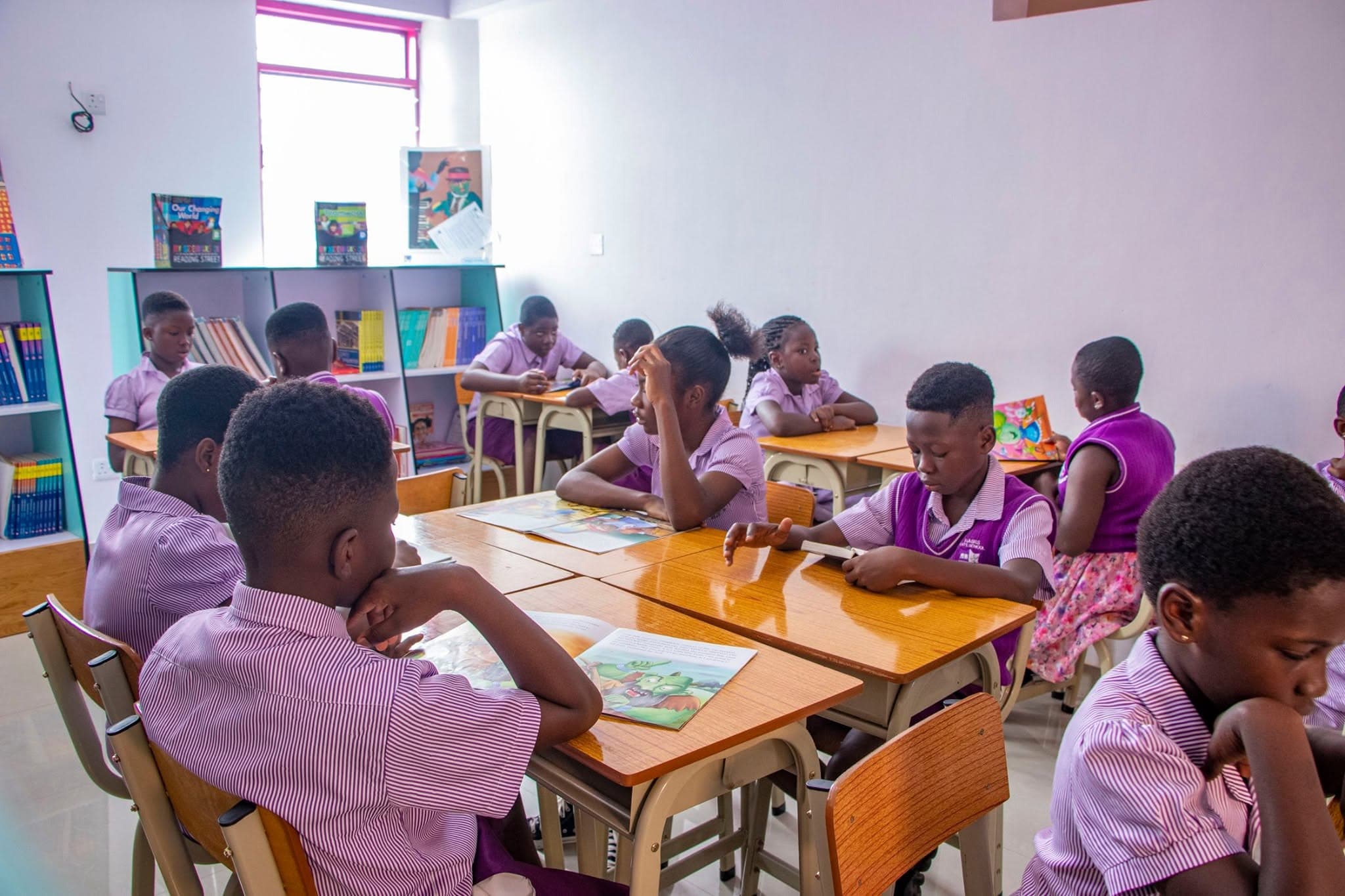 Pupils studying together in the library